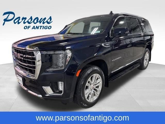 2021 GMC Yukon 4WD 4dr SLT in Midnight Blue Metallic — front three-quarter view